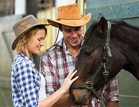 farmer couple with a horse