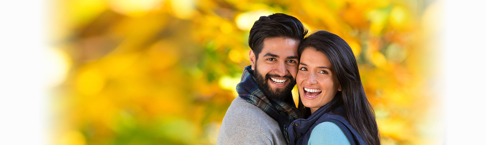 Asian couple hugging in autumn