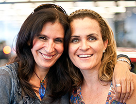 Two women hugging and happy to be together