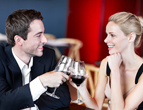 Elegant couple enjoying a glass of wine